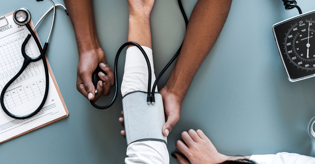 A nurse taking a patient's blood pressure