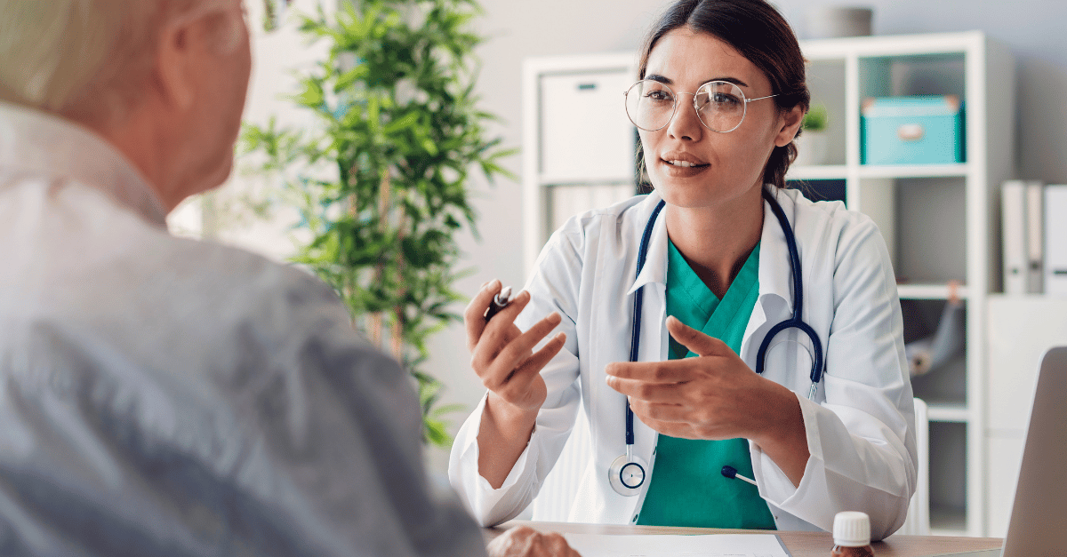 A healthcare provider speaking with a patient