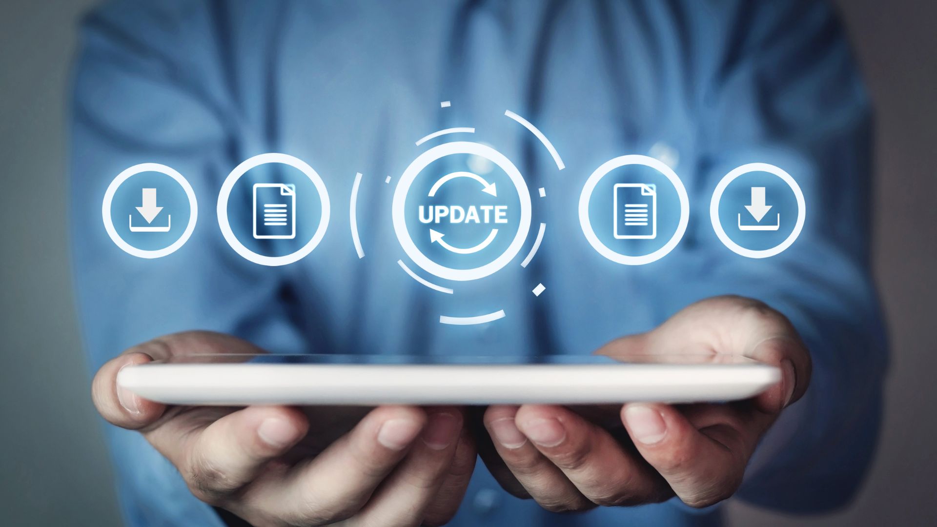 A man performing a patch update on a tablet