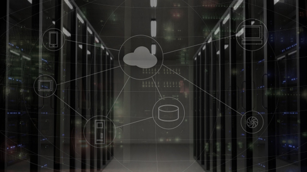 A row of servers in a data center overlaid with a cloud flowchart in the foreground.  