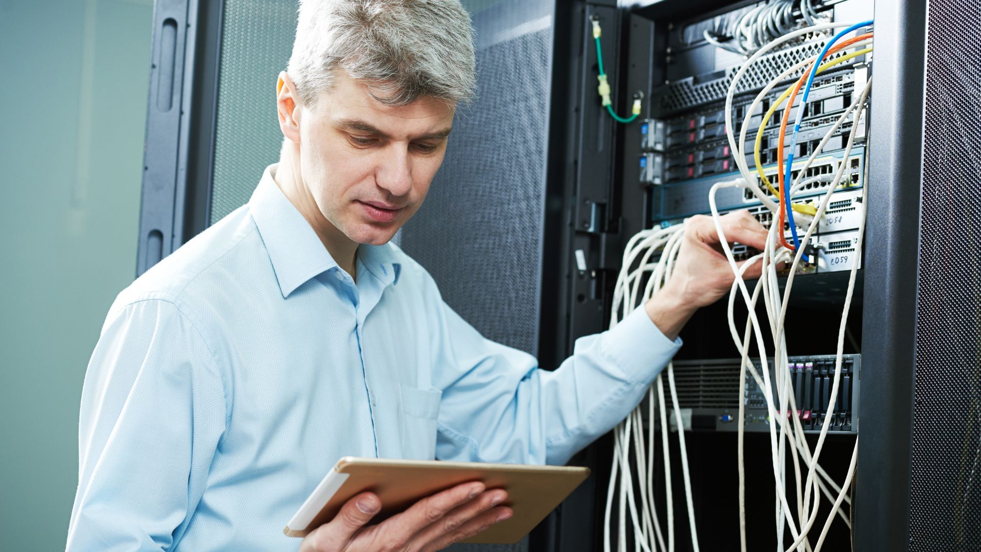 Technician working on servers in a data center